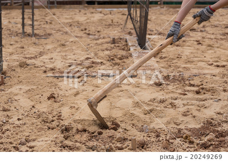 Digging the soil with a hoe at construction 20249269