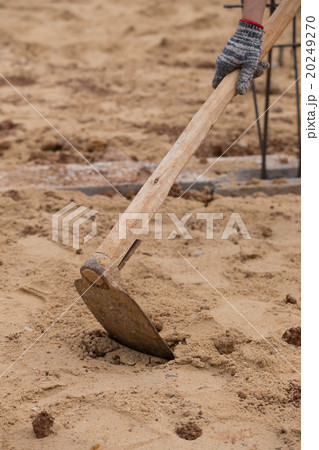 Digging the soil with a hoe at construction 20249270