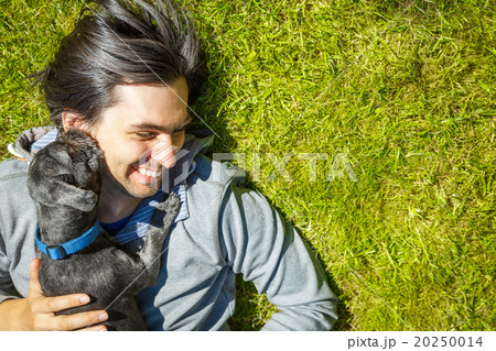 Little Pet Dog and His Owner Having Fun Outdoors Little Pet Dog and His Owner Having Fun Outdoors 20250014