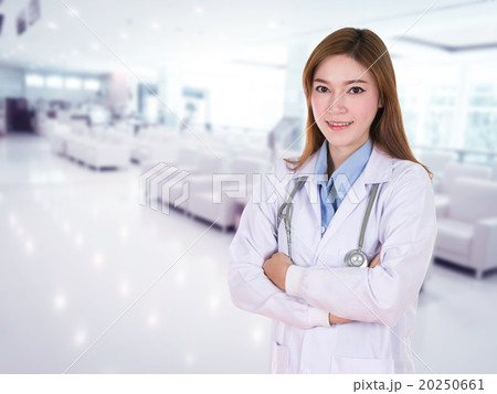 female doctor smiling with arms crossed female doctor smiling with arms crossed 20250661