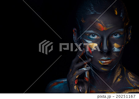 Portrait of a young woman who is posing covered Portrait of a young woman who is posing covered 20251167