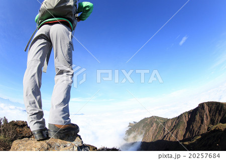 young woman backpacker hiking to beautiful mountain peak young woman backpacker hiking to beautiful mountain peak 20257684