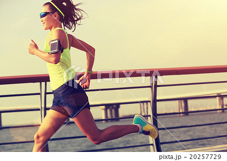 young fitness woman runner running at seaside 20257729