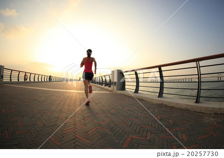young fitness woman runner running at seaside young fitness woman runner running at seaside 20257730
