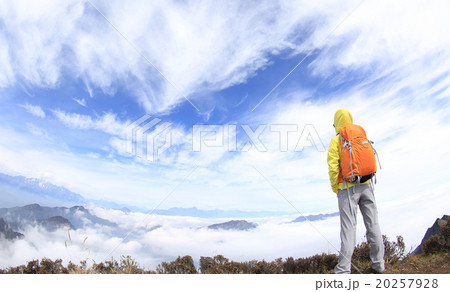 successful hiking woman backpacker on mountain peak 20257928