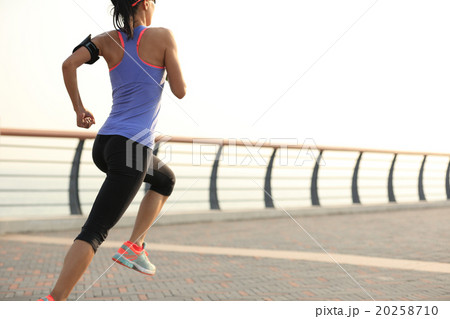young woman runner athlete running at seaside 20258710