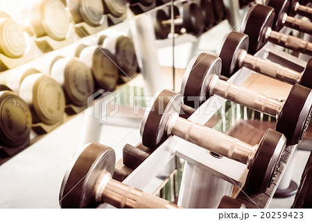 Dumbbell equipment in fitness gym room 20259423