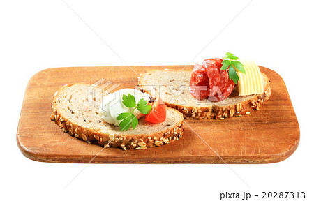 Bread with cheese spread and salami Bread with cheese spread and salami 20287313