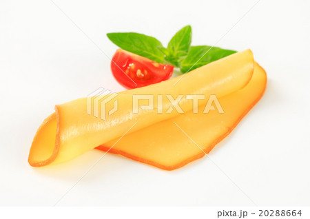 Slice of smoked cheese Slice of smoked cheese 20288664