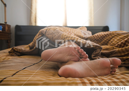 a man sleeping on bed in the morning 20290345