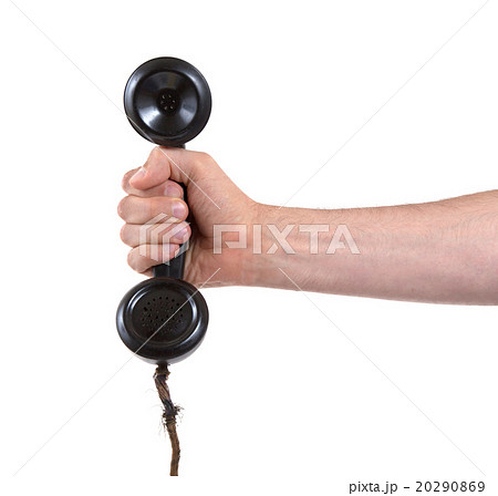 Male hand holding retro landline telephone 20290869