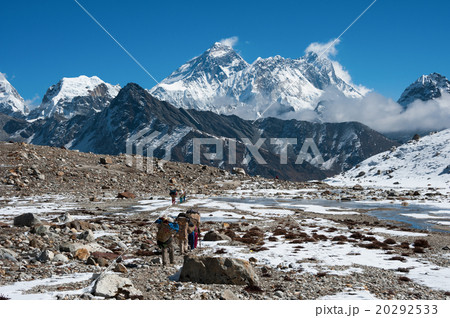 Mt.Everest and a group of porters at Renjo pass Mt.Everest and a group of porters at Renjo pass 20292533