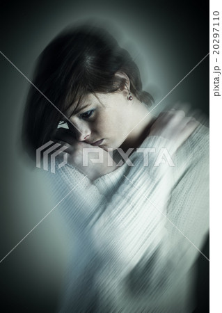 Composite image of sad pretty brunette thinking with arms crosse 20297110