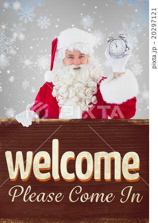 Composite image of santa claus holding alarm clock and sign 20297121