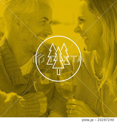 Composite image of couple enjoying white wine on picnic at the beach smiling at each other 20297240