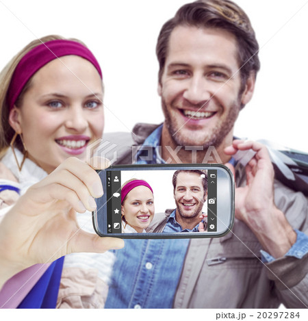 Composite image of hand holding smartphone showing Composite image of hand holding smartphone showing 20297284