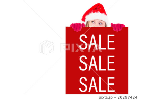 Composite image of festive blonde holding a poster 20297424
