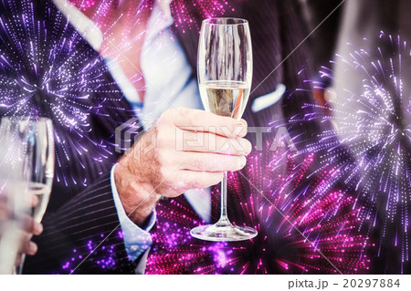 Composite image of close up of a senior businessman holding a gl Composite image of close up of a senior businessman holding a gl 20297884