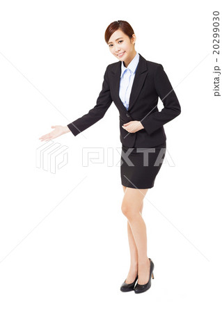 full length young  businesswoman with welcome gesture 20299030