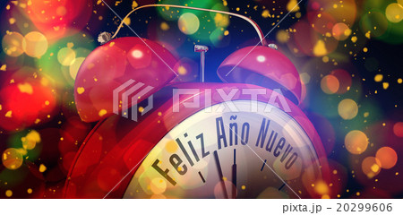 Composite image of feliz ano nuevo in red alarm clock 20299606