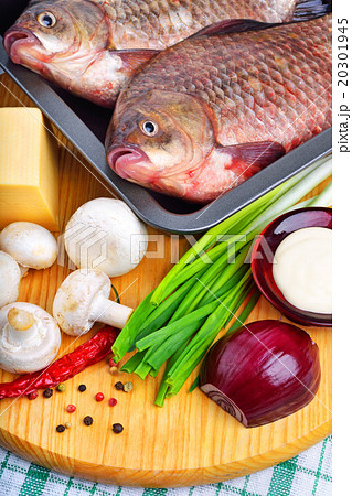 Baked fish with vegetables, sauce, red pepper Baked fish with vegetables, sauce, red pepper 20301945