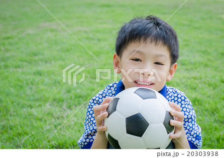 Young Asian boy with his ball in the park 20303938