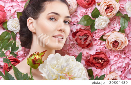 woman on a background of flowers 20304489