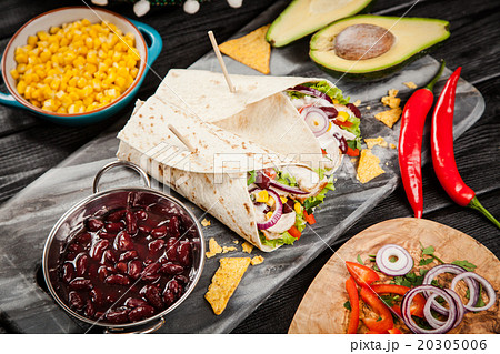 Tortilla with a mix of ingredients Tortilla with a mix of ingredients 20305006