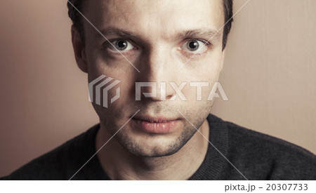 Young Caucasian man, close-up studio portrait 20307733