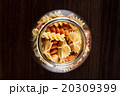 Pasta in jar on a dark wooden background close-up 20309399