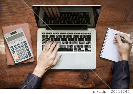 Laptop with color swatches with woman's hands 20315246