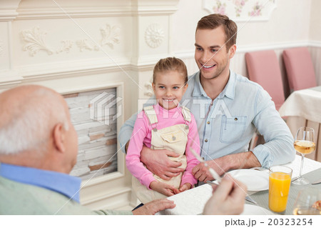 Cheerful friendly family has a lunch together 20323254
