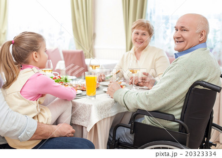 Cute friendly family is dining in restaurant 20323334