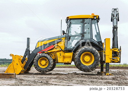 Yellow bulldozer overcome barrier Yellow bulldozer overcome barrier 20328753