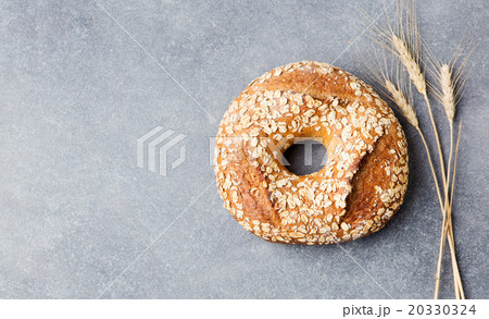 Wholegrain rustic bread Stone dark background Wholegrain rustic bread Stone dark background 20330324