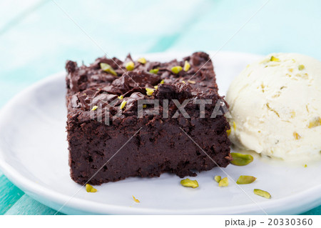 Chocolate brownie, cake on a white plate Chocolate brownie, cake on a white plate 20330360