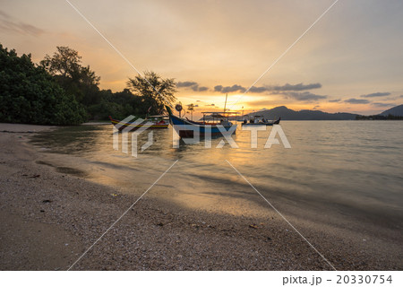 Fisherman boat at the beach during sunset Fisherman boat at the beach during sunset 20330754