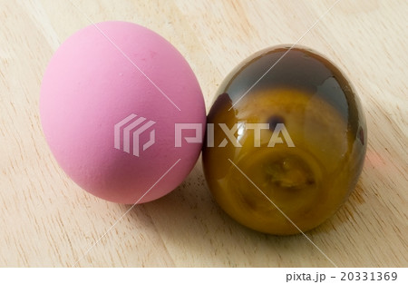 Two Pink Century Eggs on Wooden Board 20331369