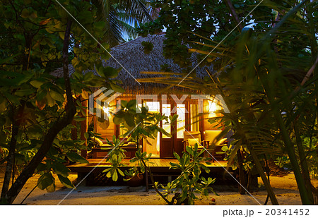 Beach bungalow at sunset - Maldives Beach bungalow at sunset - Maldives 20341452
