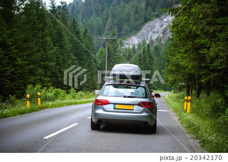 new car driving fast on a road in mountains new car driving fast on a road in mountains 20342170