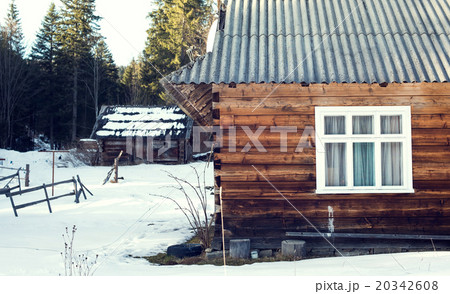 wooden house in winter forest, Mountains 20342608
