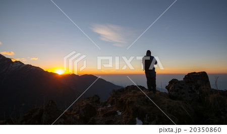 man on the top of a rock man on the top of a rock 20350860