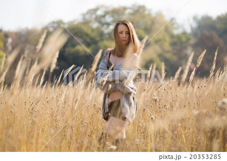 beauty girl with long red blowing hair outdoors.  20353285