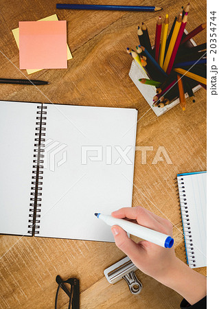 Composite image of businesswomans hand writing with marker Composite image of businesswomans hand writing with marker 20354744