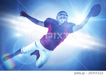Composite image of american football player scoring a touchdown 20355222