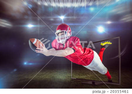 Composite image of american football player scoring a touchdown Composite image of american football player scoring a touchdown 20355461