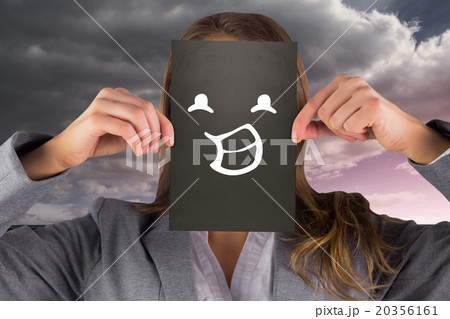 Composite image of businesswoman showing card 20356161