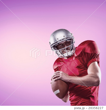 Composite image of american football player in red jersey lookin Composite image of american football player in red jersey lookin 20356227