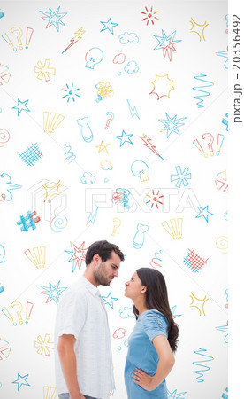 Composite image of angry couple staring at each other Composite image of angry couple staring at each other 20356492
