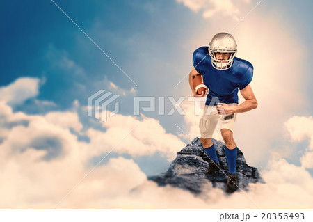 Composite image of portrait american football player holding bal Composite image of portrait american football player holding bal 20356493
